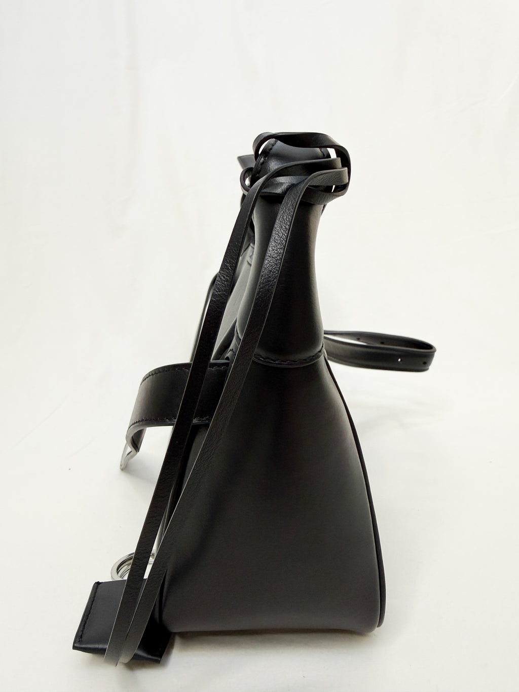 Black leather handbag on a white background