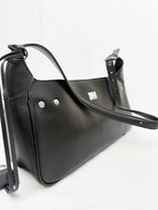 Black handbag with silver hardware on a white background