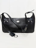 Black leather handbag with a shoulder strap on a white background