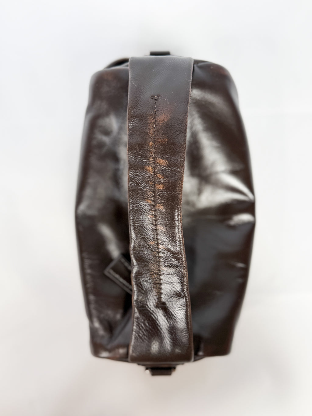 Brown leather bag on a white background