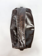 Brown leather bag on a white background